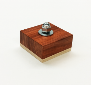 Montessori bolt block with a more challenging acorn nut for threading.