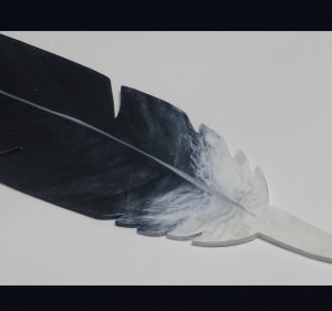 Handmade wooden Bald Eagle feather replica detail.