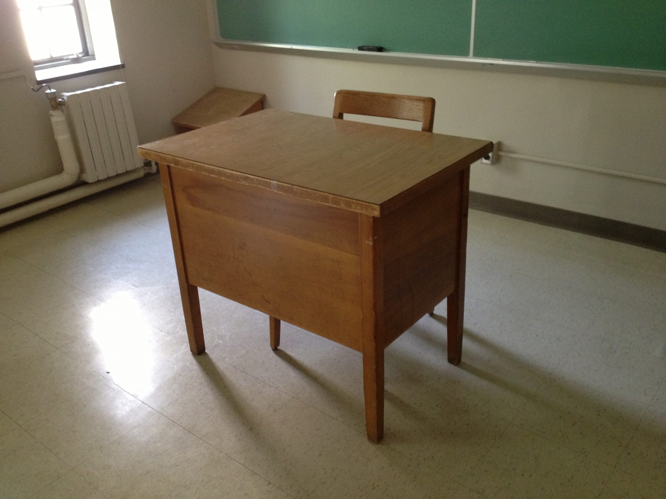 Classrooms lacking even desks.