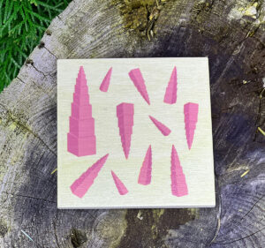 Maria Rocks Montessori wooden coasters featuring the Pink Tower.