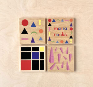 Maria Rocks wooden coasters with iconic Montessori themed images.