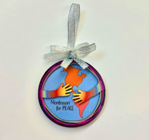 Montessori themed Christmas ornament promoting peace.