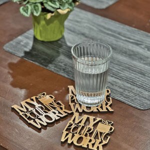 Table with glass of water showing coaster examples.