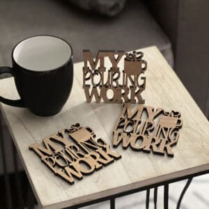 Table with coffee cup showing coaster examples.