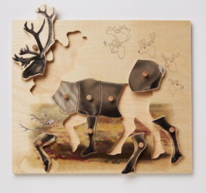 Wooden caribou puzzle with some pieces removed